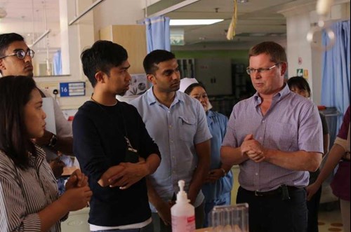 Angus on the RCSEd Tuanku Muhriz travelling fellowship talking about surgical management with medical officers and surgical masters candidates in Borneo